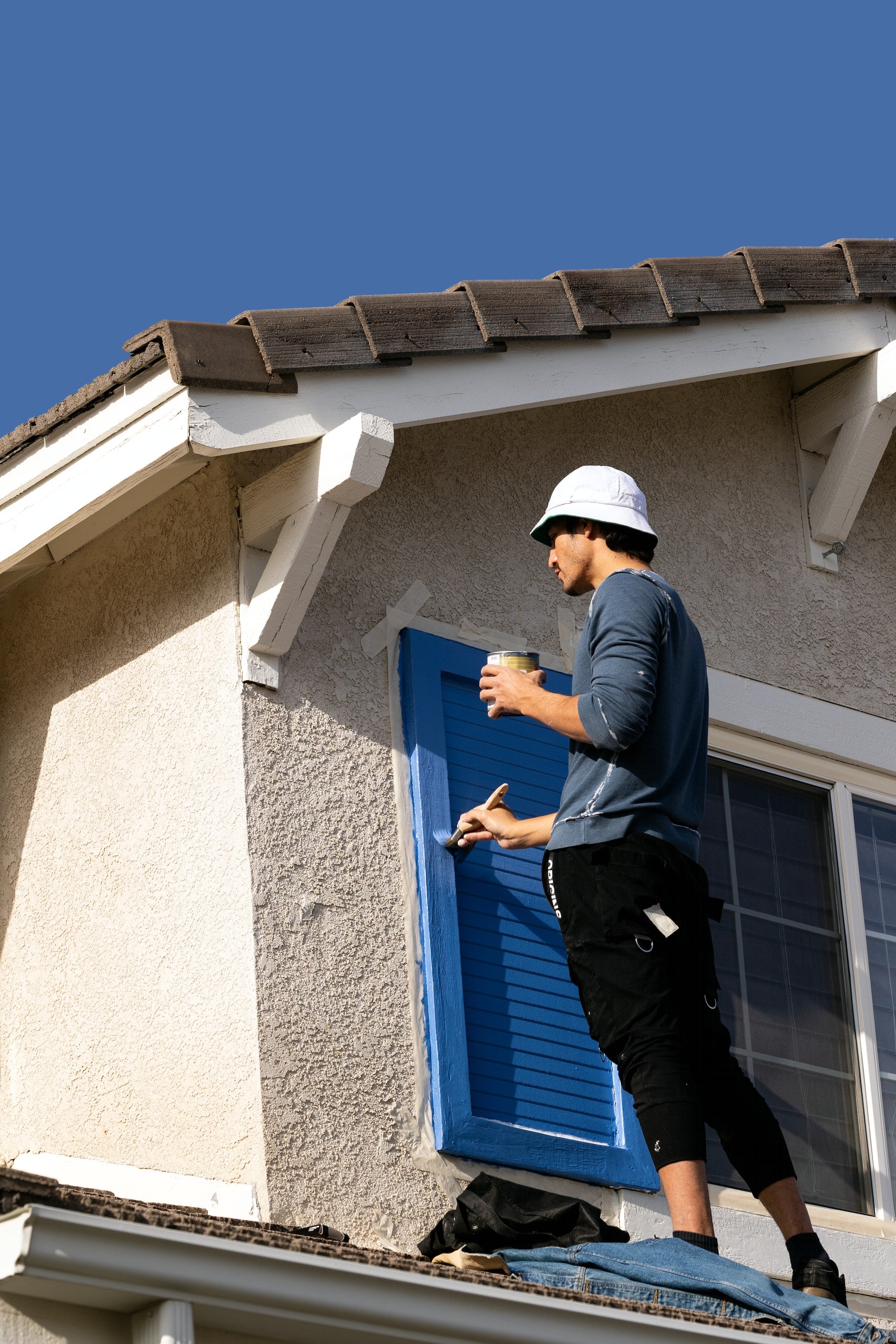 working on house paint outside